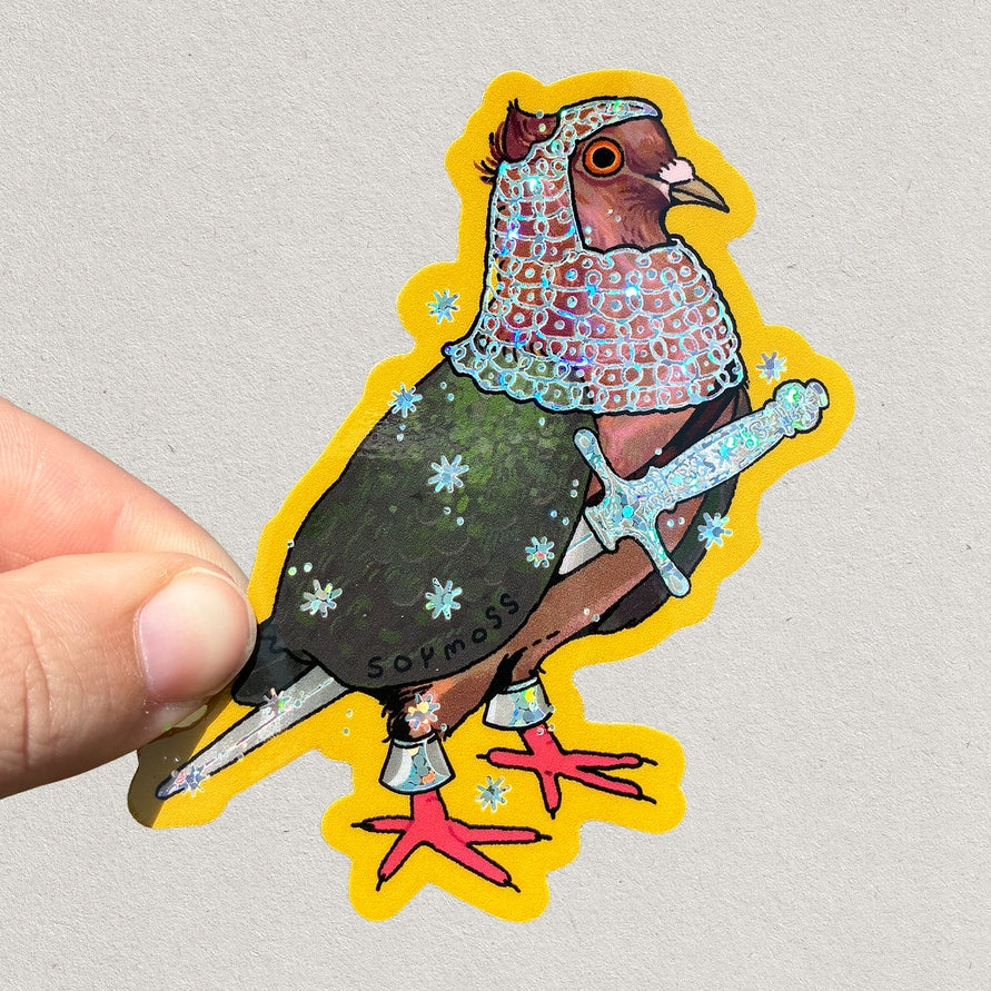 Colorful pigeon sticker with decorative elements held by a hand on a light gray background