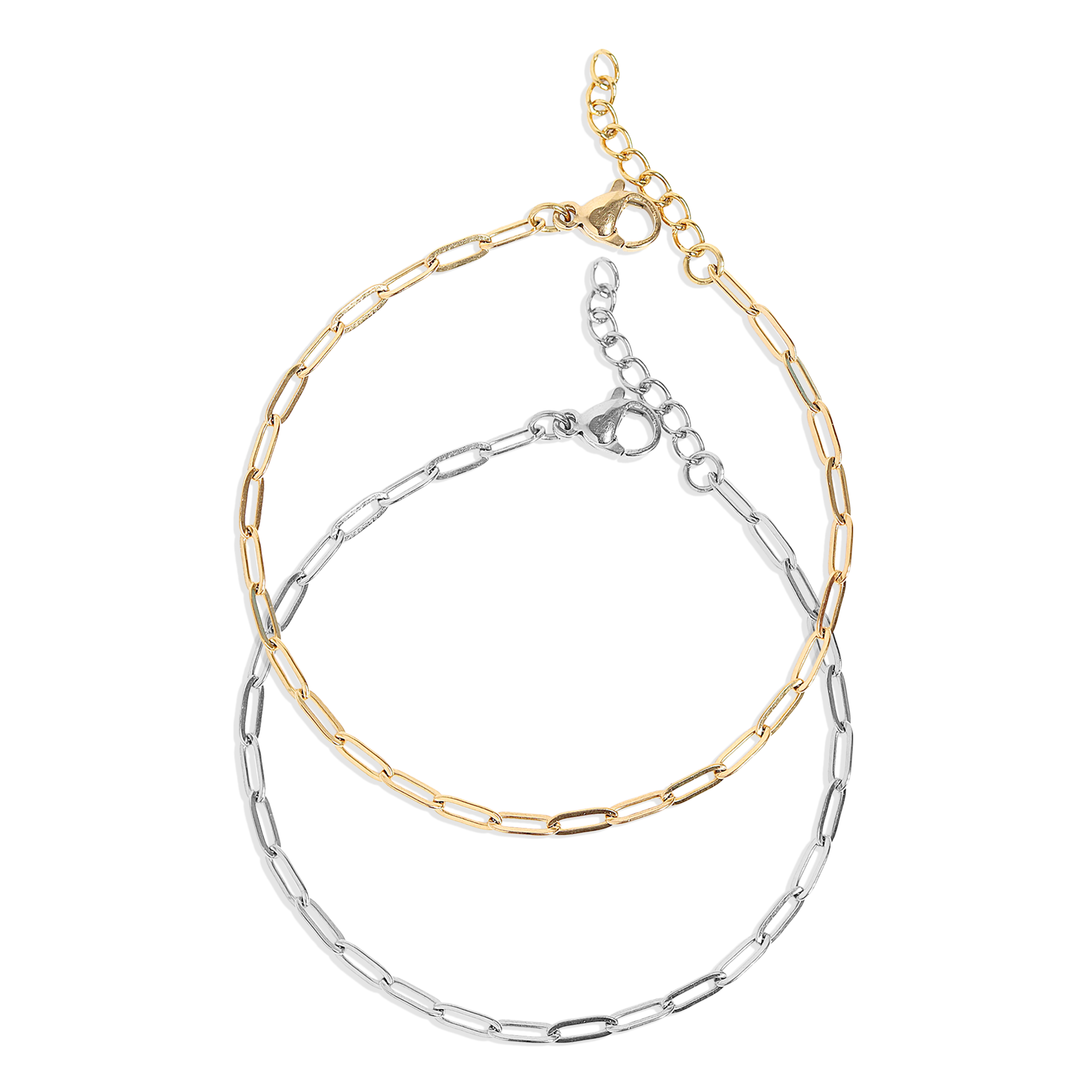 Two layered gold and silver bracelets on a white background