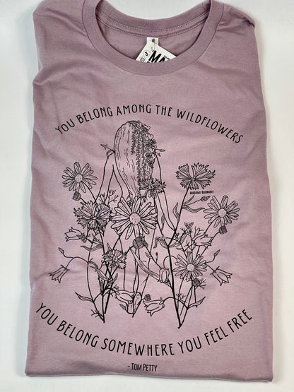 Purple t-shirt with floral design and text on a white background