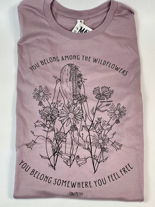 Purple t-shirt with floral design and text on a white background