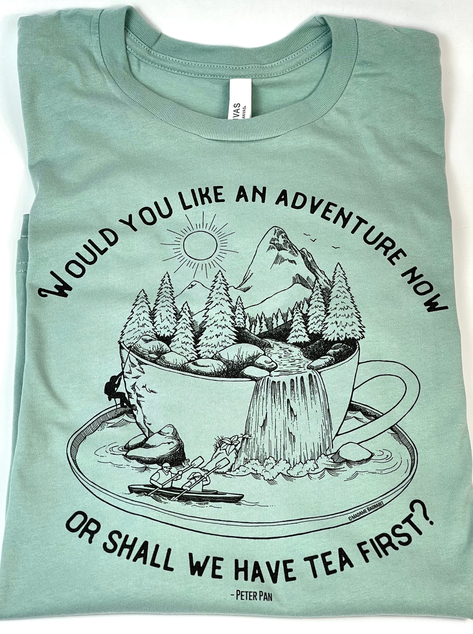 Light blue t-shirt with nature-themed graphic and text on a white background