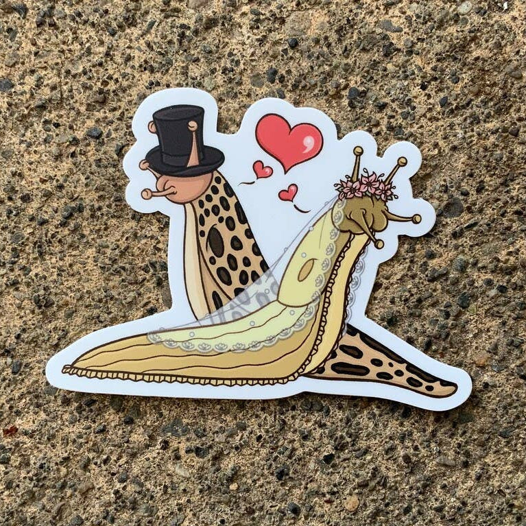 Sticker of two slugs in a romantic pose on a textured surface