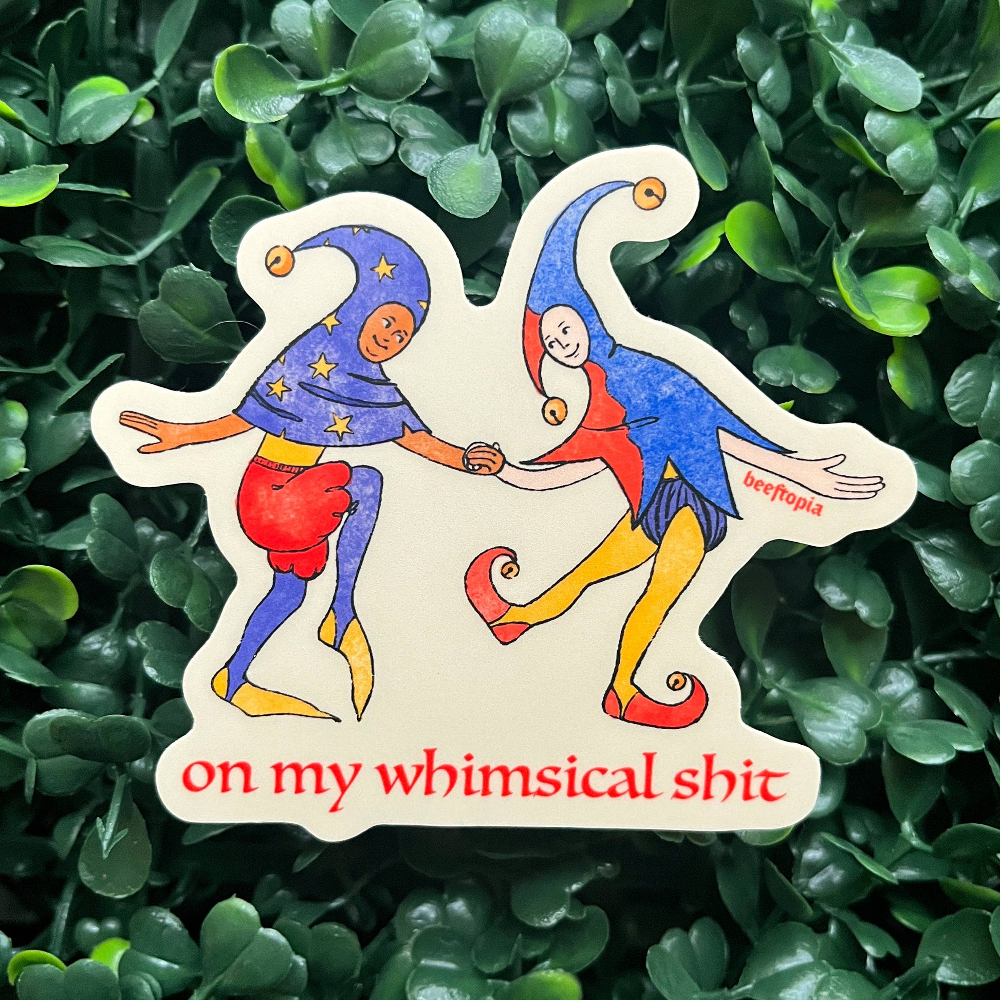 Colorful sticker with two cartoon characters on a green leafy background