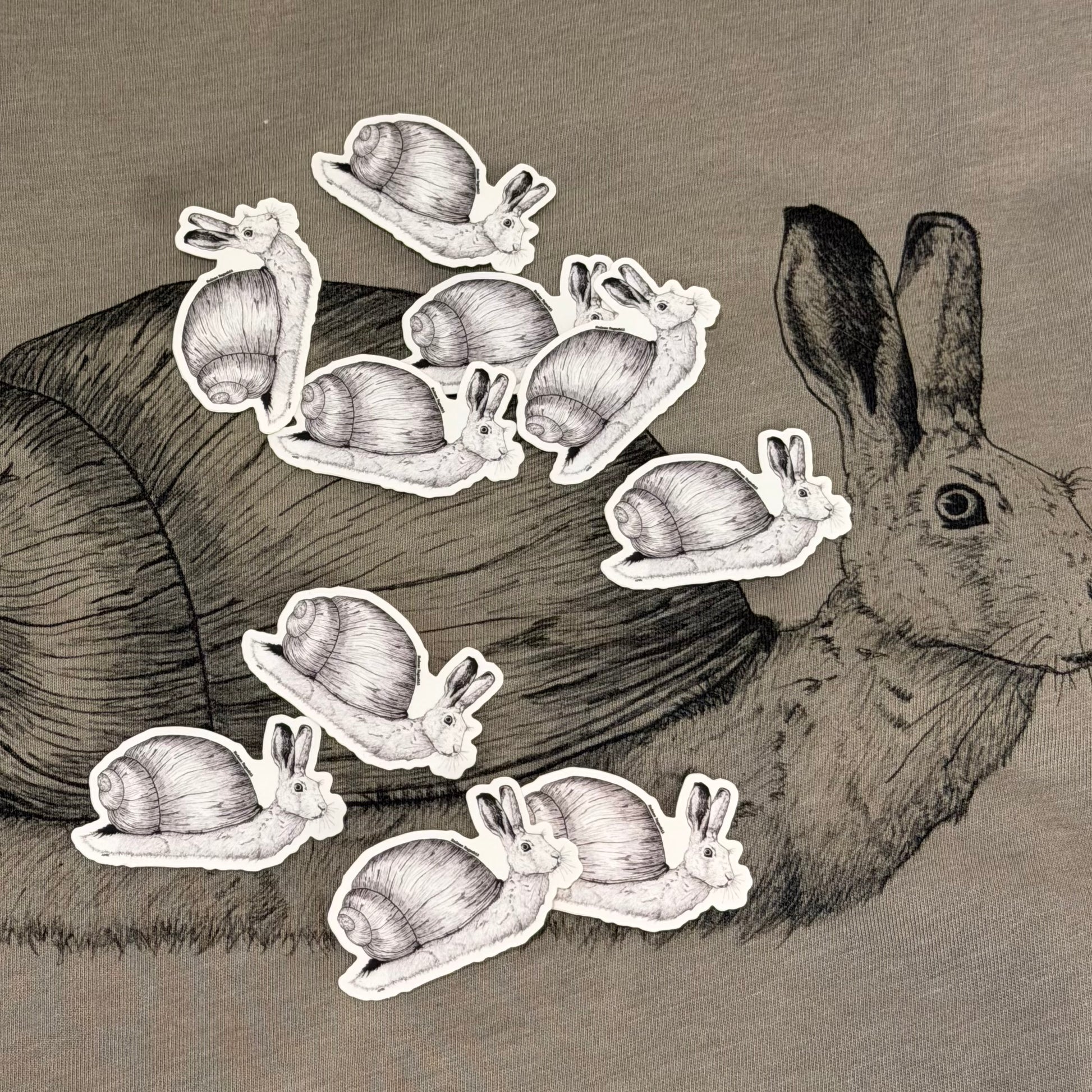 snail rabbit stickers on top of a tshirt