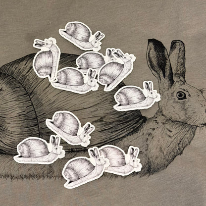 snail rabbit stickers on top of a tshirt