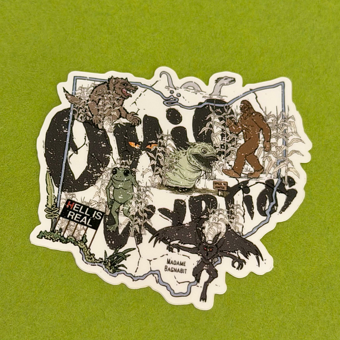 Collage of various creatures and text on a green background