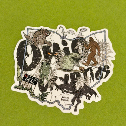 Collage of various creatures and text on a green background