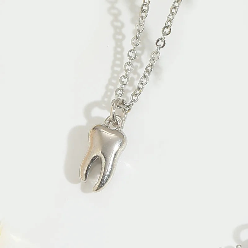 Gold or Silver tone Tooth pendant necklace