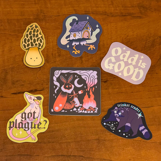 Set of six stylized stickers on a wooden surface