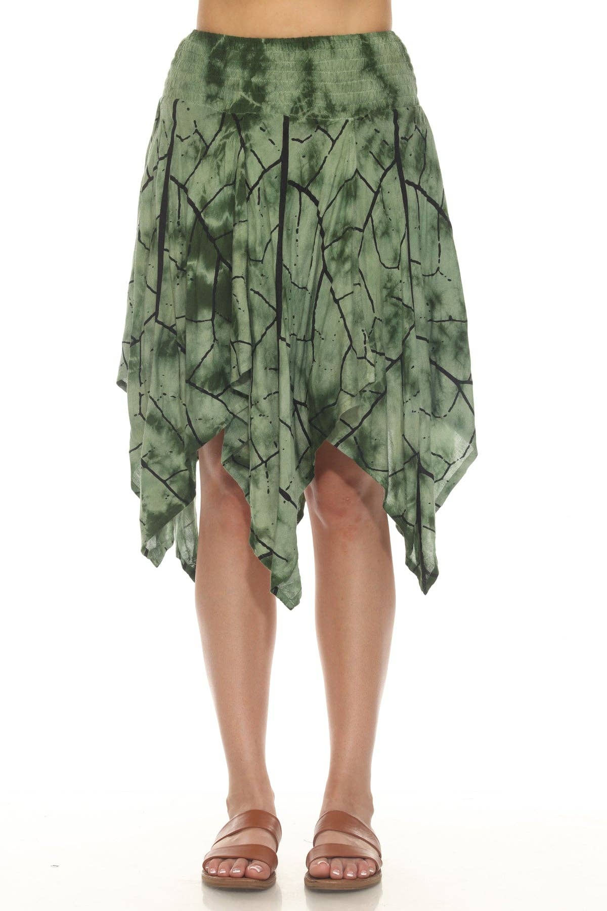 Green tie-dye skirt worn by a person on a white background