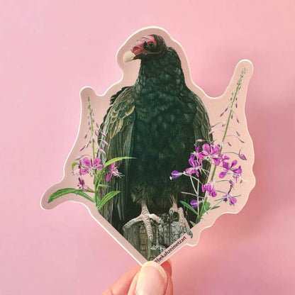 Sticker of a green bird with pink flowers on a pink background